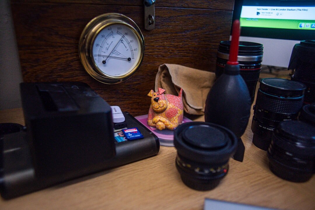 Vintage film camera and notebook on a wooden desk